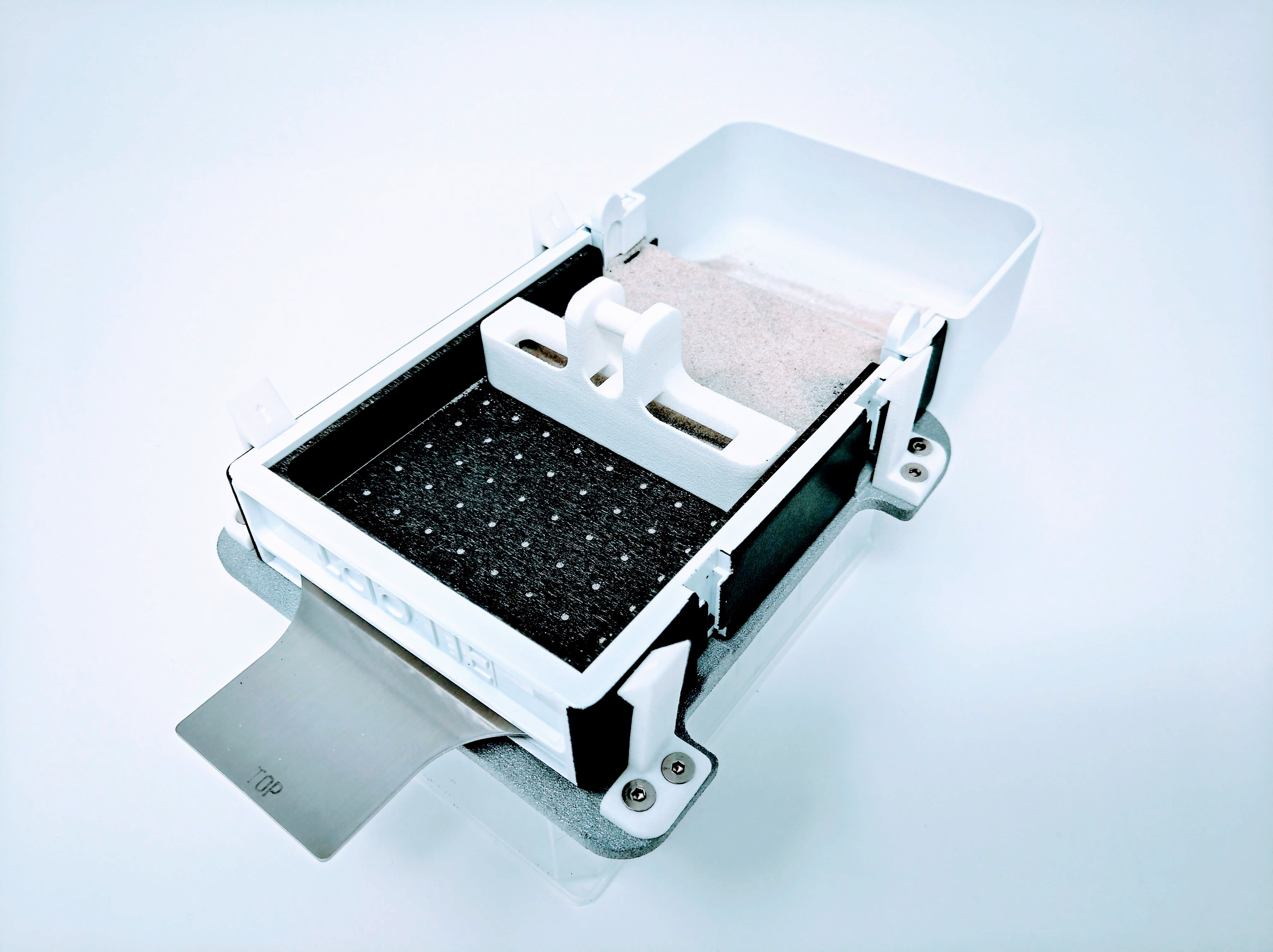 LabTIE powder dispenser dosing powder into a multiwell plate